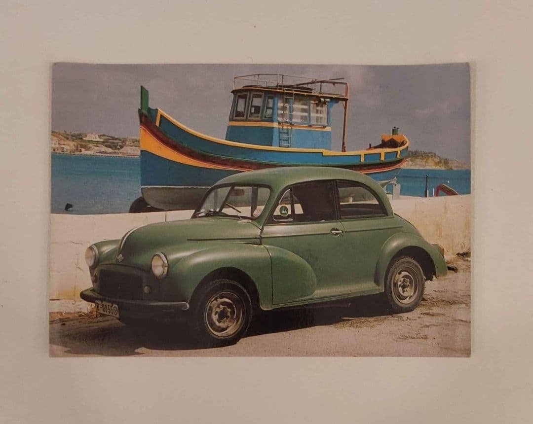 Old Postcard of Morris Minor and Luzzu Boat